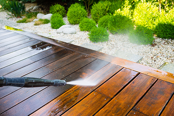 Washing off wood deck.