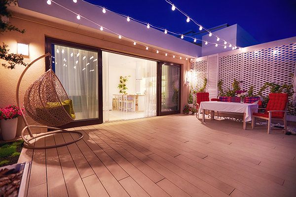 evening patio area with open space kitchen and sliding doors