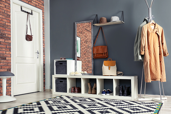 Stylish hallway interior with mirror and hanger stand