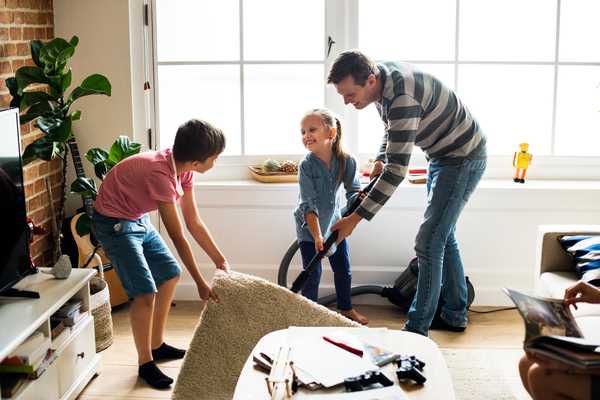 Kids doing chores with parent.